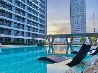 a swimming pool in the middle of a building at The Metro Suite - 1BR Condo 36F with City View in Manila