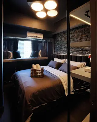 a bedroom with a bed and a desk and a sink at Luxury Condo in the heart of BGC in Manila
