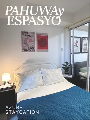 a bedroom with a bed and a sign that says railwayasy at Azure Bahamas by Pahuway Espasyo in Manila