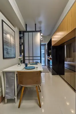 a kitchen with a table and a dining room at Minimalist Stay Mall of Asia WiFi, Netflix, Self Checkin in Manila