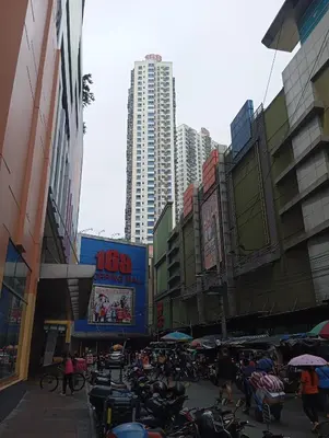 a group of motorcycles parked in a city with tall buildings at Pristine Hotel in Manila