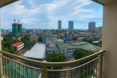 a view of a city from a balcony at La Suitez 1421 l Sky Studio l 360 City l Sea View in Manila