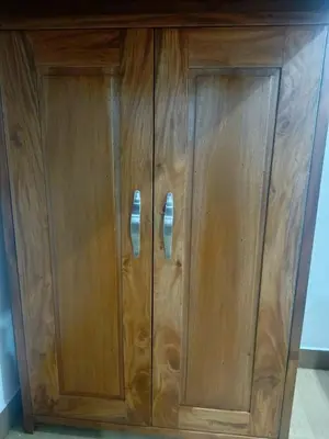 a wooden cabinet with two doors at Happy Stays E - 300mbps - 65
