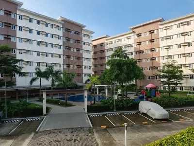 an empty parking lot in front of a building at Happy Stays E - 300mbps - 65