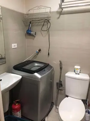 a small bathroom with a toilet and a sink at S Residences Tower 1 Staycation in Manila