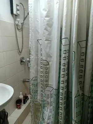 a shower curtain with a drawing of a city at Your Home Away from Home in Manila