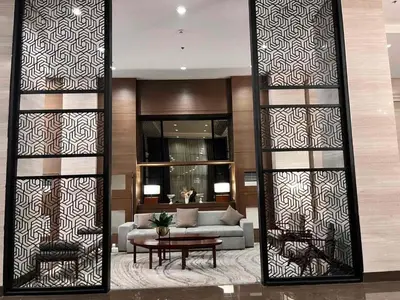 a living room with a couch and a table at Bayview near CCP, PICC, Airport, MOA, Okada at Radiance in Manila