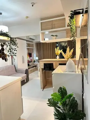 a kitchen and living room with plants in it at SM Bicutan MNL in Manila