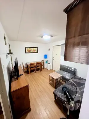 a living room with a couch and a table at Ysabella's Abode in Manila
