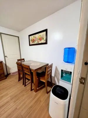 a dining room with a table and some chairs at Ysabella's Abode in Manila