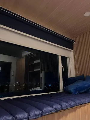 a large window with a view of a city at SolAzur Staycation SMDC South Residences Las Piñas with 100MBPS Wifi &NETFLIX &BAR STATION &CITY LIGHTS VIEW in Manila