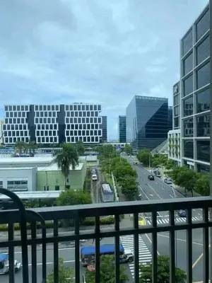 a view of a city with buildings and a street at Cozy Couple Room near mall of asia in Manila