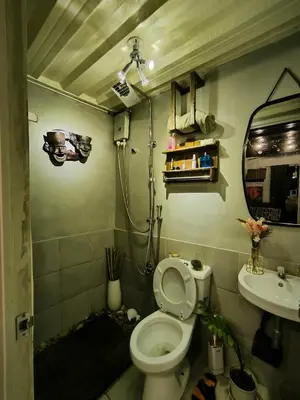 a bathroom with a toilet and a sink at Unit 820 Zamora sky tower in Manila