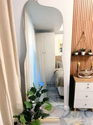a room with a mirror and plants in it at AZURE STAYCATION by TALA in Manila
