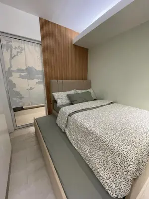 a bedroom with a bed and a large window at Supreme Luxury 2BR Condo - Azure Urban Resort Residences near Manila Airport in Manila