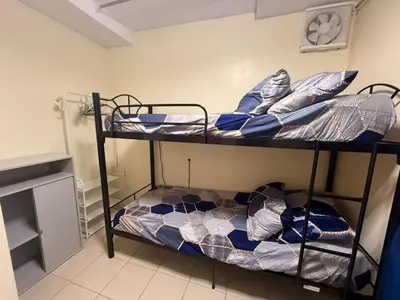 two bunk beds in a small room with at FamBnb in Manila