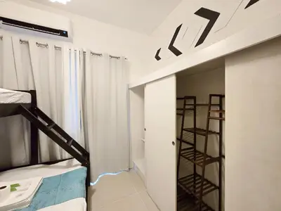 a room with a bunk bed and a ladder at 1BR Condotel with Balcony at FAME Residences #FM40-1 in Manila