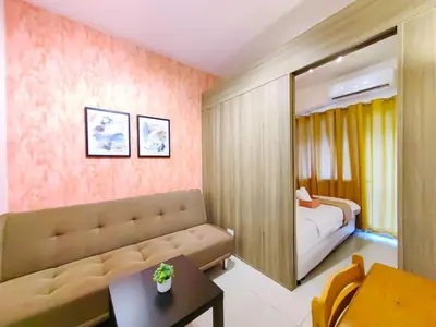 a living room with a couch and a bedroom at 1BR Condotel with Balcony at FAME Residences #FM02-1 in Manila