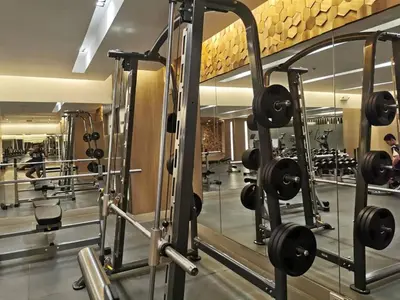 a gym with a row of tread machines at Mall of Asia condotel residence shore 3 in Manila