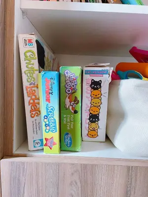 four childrens books are sitting on a shelf at Eco Suite Hope Residences Trece in Trece Martires