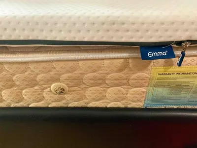 a mattress on a shelf with a tag on it at Avant at the Fort King bed Central 5mins to Highstreet BGC in Manila