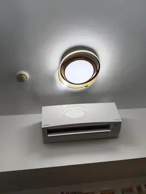 a recessed light in a ceiling with a mirror at Paradise Staycation at South in Manila