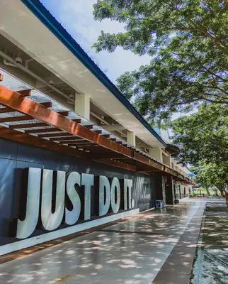 a building with the words just do it on it at Bright & Cozy High-Rise Condo in Pulong Cacawate