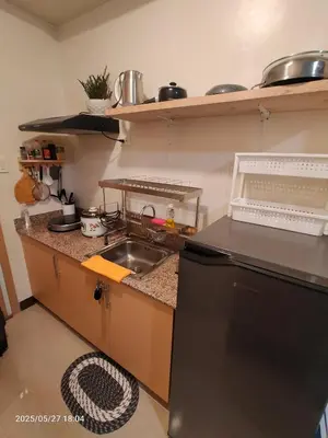 a kitchen with a sink and a counter top at 1123 Field Res Condo by Bambie free drinking water in Manila