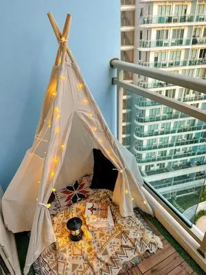 a teepee tent sitting on top of a balcony at SM Condotels by Maui in Manila