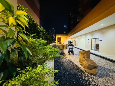 a lobby of a building at night with plants at \u5eb7\u5bbf \u6ec4\u6d77\u5c45 Sea Horizon in Sampong