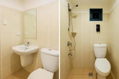 a bathroom with a toilet and a sink and a shower at \u5eb7\u5bbf \u6ec4\u6d77\u5c45 Sea Horizon in Sampong