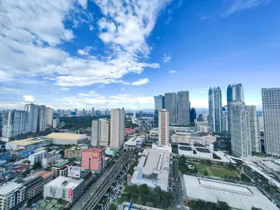 a view of a city with tall buildings at 1BR Condotel with Balcony at FAME Residences #FM03-1 in Manila