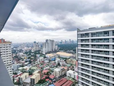 a view of a city from a tall building at 1BR Condotel with Balcony at FAME Residences #FM15-1 in Manila