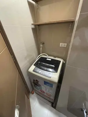 a trash can in a corner of a bathroom at Rqui Rooms Near airport and Newport World Resorts in Manila