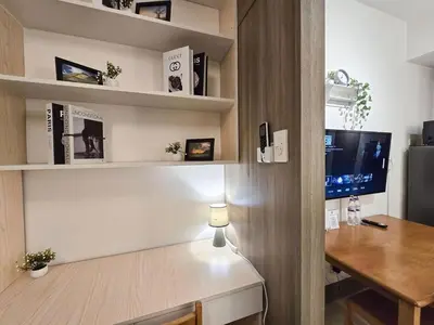 an office with a desk and a computer in a room at 1BR Condotel with Balcony at FAME Residences #FM22-1 in Manila