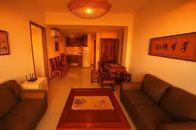 a living room with a couch and a table at \u5eb7\u5bbf \u89c0\u703e\u9f4b Guan Lanzhai Studio in Sampong