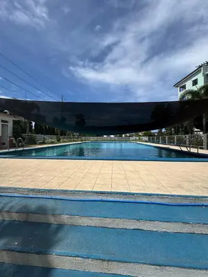 a swimming pool with at D88Staycations 104 - Condo near Enchanted Kingdom in Santa Rosa