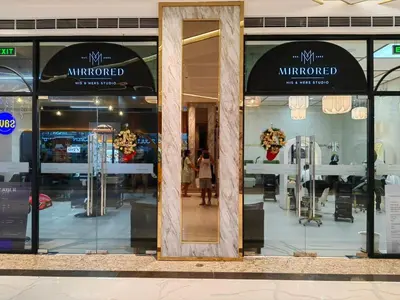 a window of a store with a mirror in it at 1BR Condotel with Balcony at FAME Residences #FM32-1 in Manila