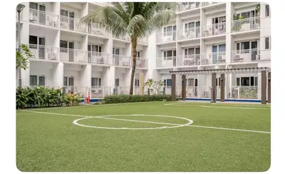 a basketball court in front of a building at Porongs Oasis in Manila