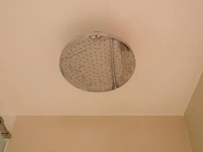 a light fixture hanging from a ceiling in a room at The Hotel Residences at Acqua Tower in Manila