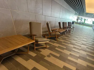 a row of chairs and tables in a waiting room at air residences in Manila