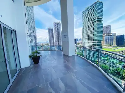 a balcony with a view of a city skyline at The Hotel Residences at Acqua in Manila