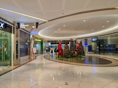 a shopping mall with christmas trees in the middle at 1BR Condotel with Balcony at FAME Residences #FM49-1 in Manila