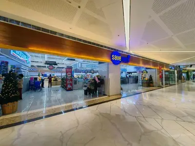 a shopping mall with a sign for a store at 1BR Condotel with Balcony at FAME Residences #FM49-1 in Manila