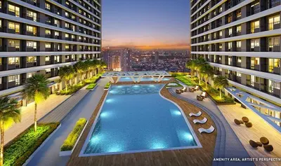 an aerial view of a building with a swimming pool at 1BR Condotel with Balcony at FAME Residences #FM56-1 in Manila