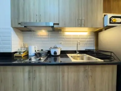 a kitchen with a sink and a counter top at MOA Staycation at Shore 2 Residences Tower 3 in Manila