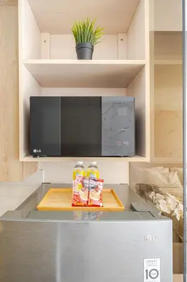 a kitchen with two bottles of food on a counter at Hotel Like Staycation Near Airport and MOA Porongs Oasis in Manila