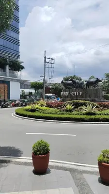 a street with two pots on the side of a road at Rose150newportpasay in Manila