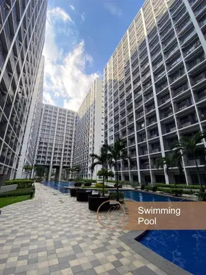 a view of a building with two tall buildings at Modern Unit at Shore 2 Mall of Asia by Elle Suite in Manila