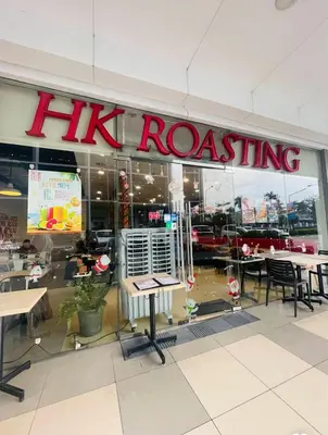 a restaurant with a hk roasting sign on the window at Modern Unit at Shore 2 Mall of Asia by Elle Suite in Manila